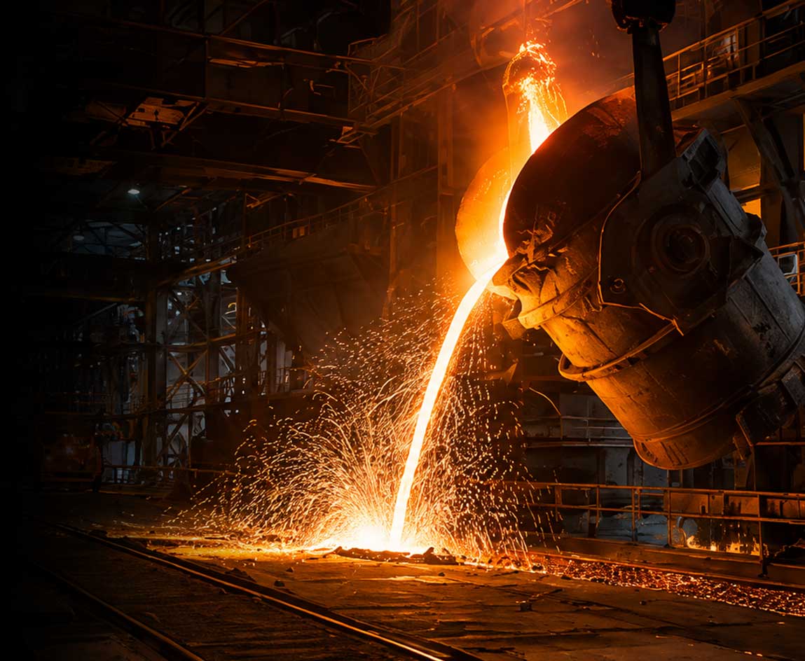 Molten metal pour beside railway tracks in a heavy industrial plant